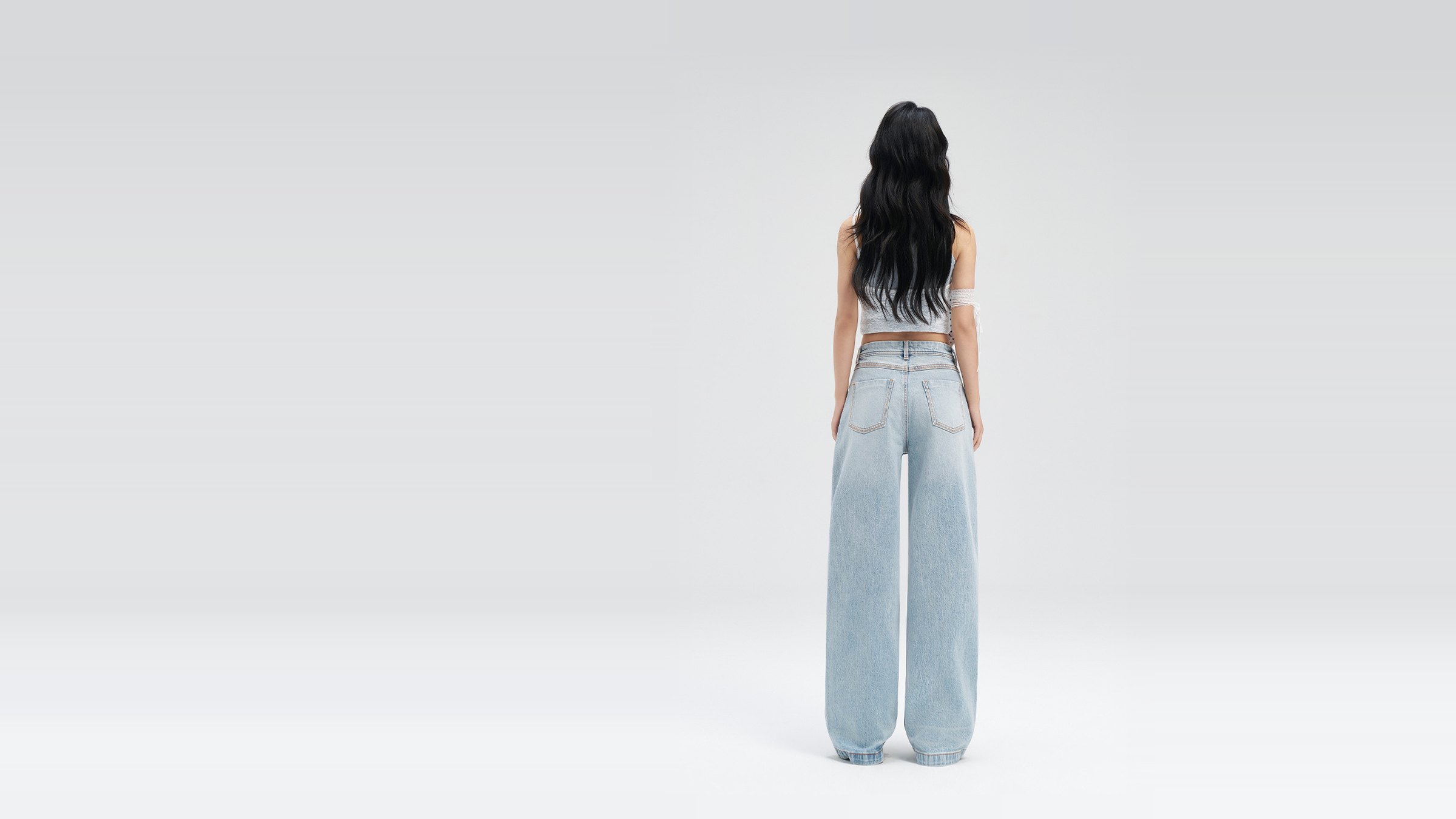 Model from behind in the Wide-Leg Jean, light wash